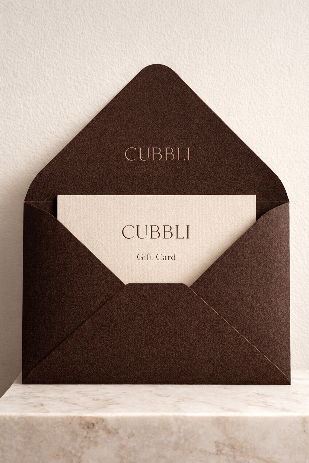 CUBBLI gift card in a chocolate brown envelope