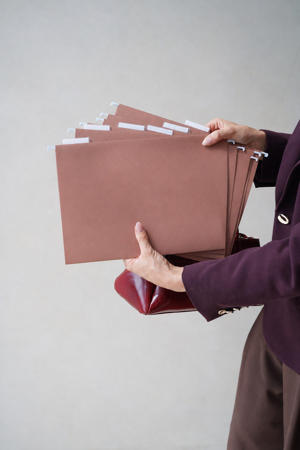 Hands holding a fanned stack of CUBBLI expansion files