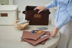 CUBBLI Chocolate and Cream keepsake boxes open on a table with folders and a pen