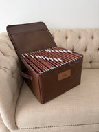 Open CUBBLI Chocolate keepsake box full of labelled folders, on a sofa